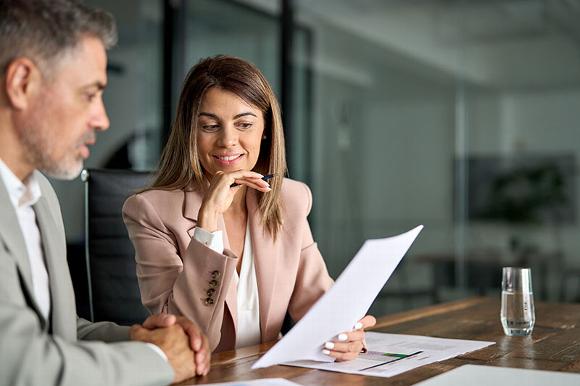 business directors looking over proposal